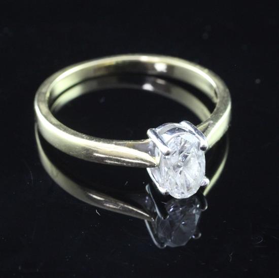 A modern 18ct gold and solitaire diamond ring, size P.